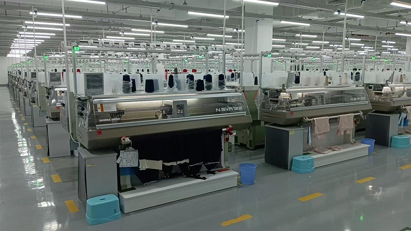 Computerized flat knitting machines at WDH knitwear factory